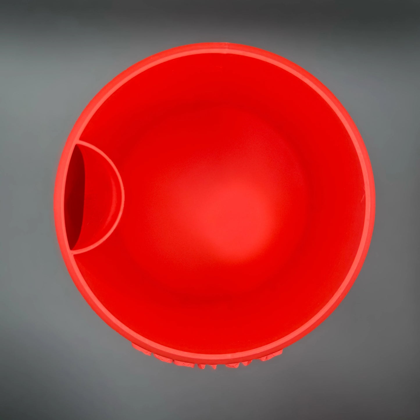 Top-down view of a red Potfolia plant pot.