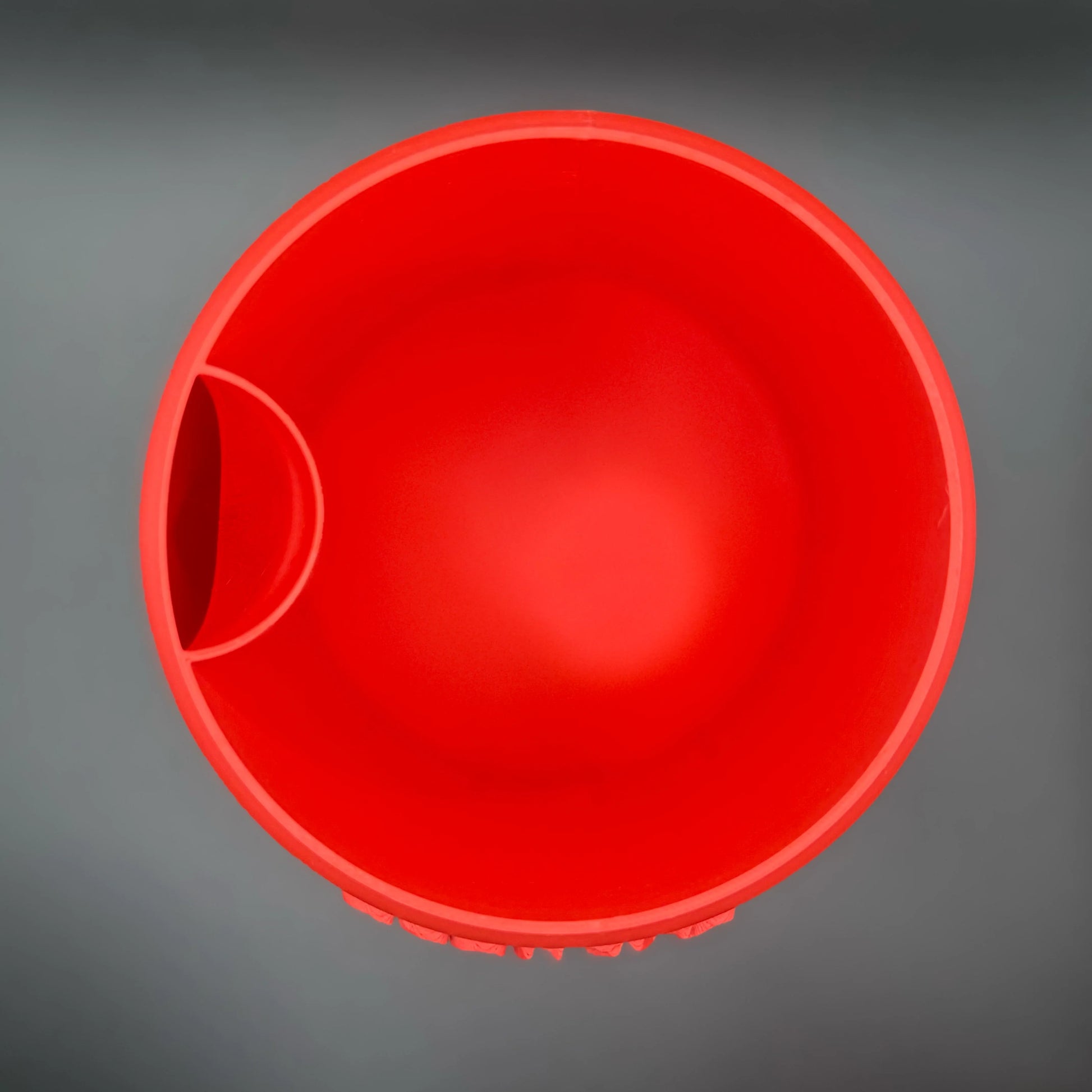 Top-down view of a red Potfolia plant pot.