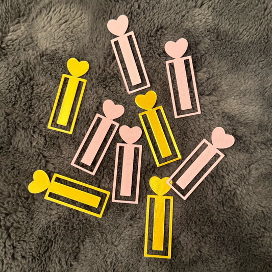 Decorative bookmarks gold and pink with heart designs on a fluffy soft  surface
