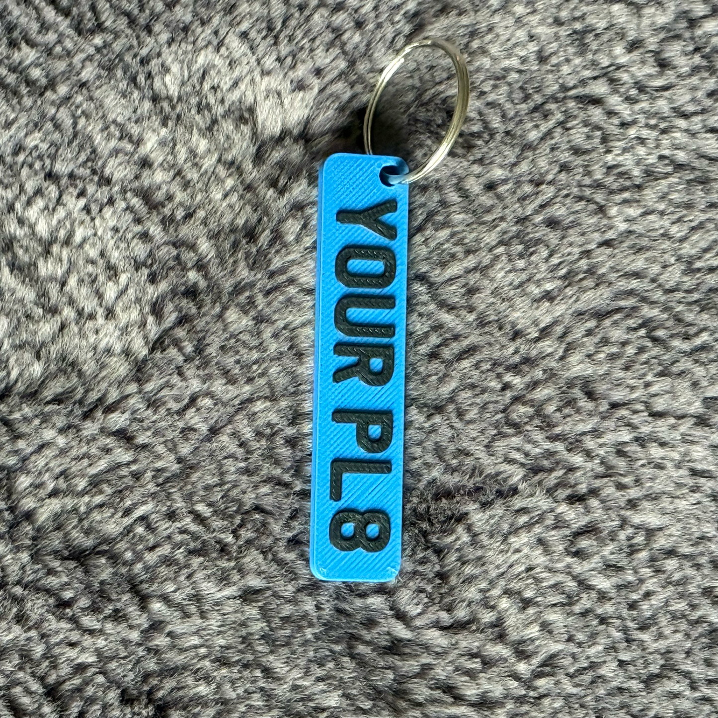 BLUE RECTANGLE LICENSE PLATE WITH YOUR PL8 ON IT ON A GREY LUXORY FLUFF BACKGROUND