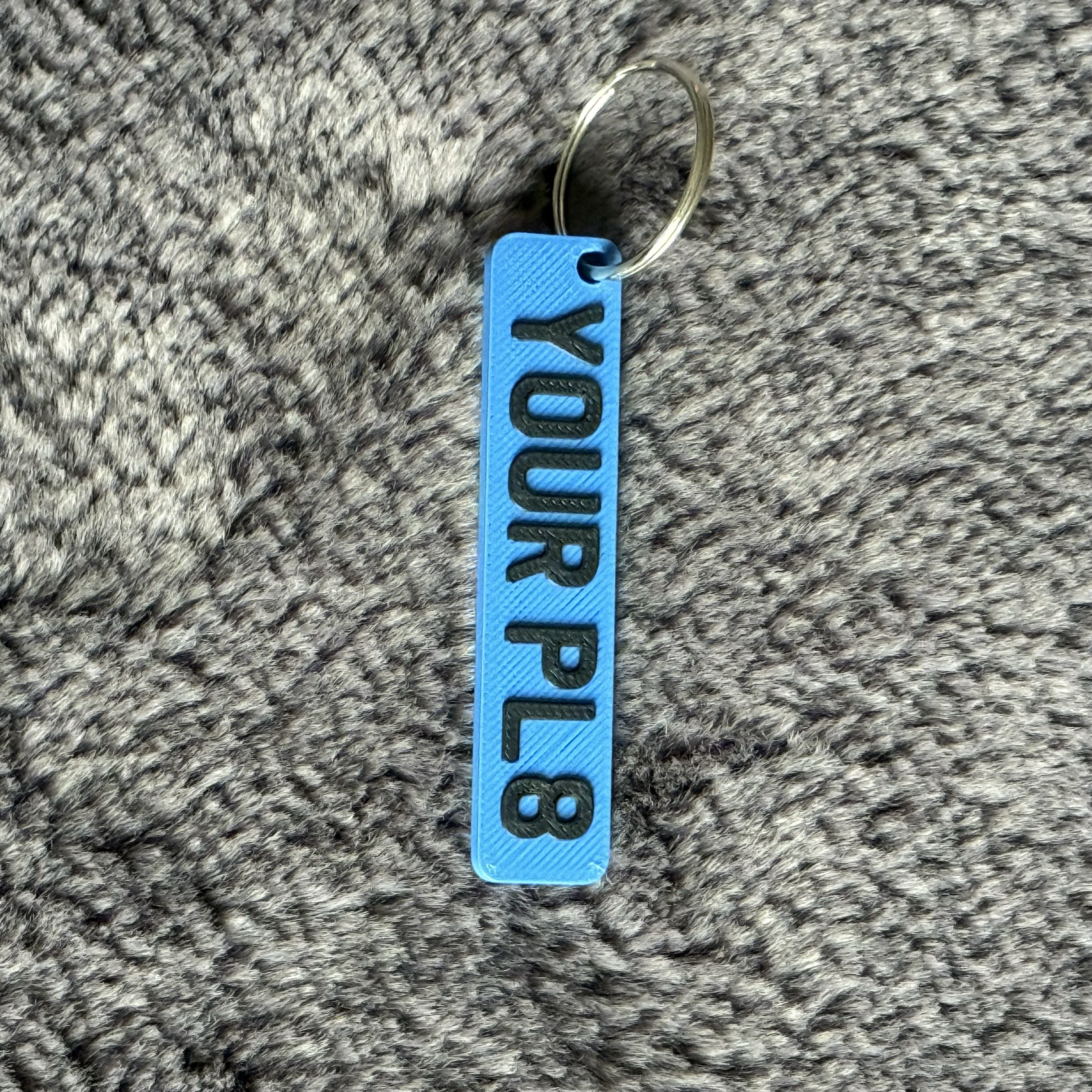 BLUE RECTANGLE LICENSE PLATE WITH YOUR PL8 ON IT ON A GREY LUXORY FLUFF BACKGROUND